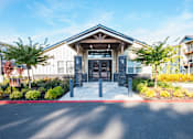 Thumbnail 39 of 47 - the front entrance of a building with trees and a driveway