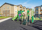 Thumbnail 35 of 47 - a playground in front of an apartment building
