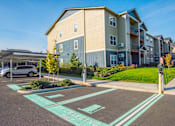Thumbnail 44 of 47 - an empty parking lot in front of an apartment building