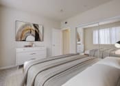 Thumbnail 4 of 24 - 3-Bedroom Apartments in Sacramento, CA - Avanti - Bedroom with Plush Carpeting, Full-Size Bed, Dresser, Double Mirror Closet Doors, and Wall Art