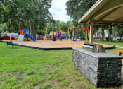 Thumbnail 21 of 21 - Chelsea Apartments in Gainesville Florida photo of playground and grill area