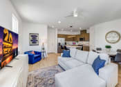 Thumbnail 2 of 41 - Skye Canyon, NV Apartments Near Centennial Hills - Banyan Brighton - Living Room with Open Layout and Wood-Inspired Flooring