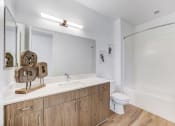 Thumbnail 6 of 41 - a bathroom with a toilet sink and a mirror