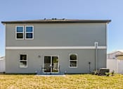 Thumbnail 2 of 23 - Ruskin, FL Homes - Ruskin Reserves Luxury New Home with Large Driveway and Attached Garage and Spacious Backyard
