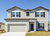 Thumbnail 1 of 23 - Ruskin, FL Homes - Ruskin Reserves Luxury New Home with Large Driveway and Attached Garage and Spacious Backyard