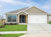 Thumbnail 14 of 46 - a house with a white garage door and a sidewalk in front of it