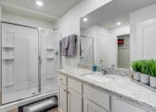 Thumbnail 13 of 46 - Three BR Apartments in North Denton, TX - Beall Way - Spacious Bathroom with Granite Countertop, Sink, and Shower.