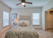 Thumbnail 19 of 33 - bedroom with carpet and ceiling fan and walk in closet and window with blinds