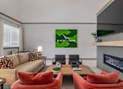 Thumbnail 16 of 18 - Blue Sky Landing apartments clubhouse living room with comfortable seating, fireplace and pet-friendly resident lounge near Old National Parkway in College Park, GA close to South Fulton and Hartsfield-Jackson Atlanta International Airport.