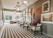 Thumbnail 14 of 18 - Stylish clubhouse interior and resident lounge entrance at Blue Sky Landing apartments in College Park, GA near Camp Creek Marketplace and Atlanta Airport.