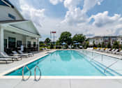 Thumbnail 2 of 18 - Resort-inspired community swimming pool at Blue Sky Landing apartments in College Park, GA near Hartsfield-Jackson Atlanta International Airport and Old National Parkway.