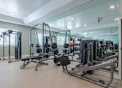 Thumbnail 3 of 18 - Fully equipped fitness center at Blue Sky Landing apartments in College Park, GA with cardio and strength training equipment near Atlanta Airport and Old National Highway.