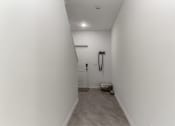 Thumbnail 25 of 30 - Boatman Hammock Townhomes in Lake Worth, FL photo of a bathroom with a shower and a toilet in a white room