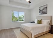 Thumbnail 15 of 30 - Boatman Hammock Townhomes in Lake Worth, FL photo of an empty bedroom with a bed and a window