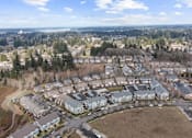 Thumbnail 25 of 26 - A bird's eye view of a residential area with houses and trees.