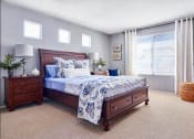 Thumbnail 5 of 14 - Four-Bedroom Apartments in Tustin, CA - Tustin Cottages - Bedroom with Carpeting, Single Hung Windows, and Matching Bedroom Furniture
