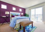 Thumbnail 6 of 14 - Four-Bedroom Apartments in Tustin, CA - Tustin Cottages - Bedroom with Carpeting, Single Hung Windows, and Matching Bedroom Furniture