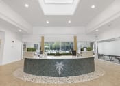 Thumbnail 20 of 35 - Pet-Friendly Apartments in Savannah, GA – The Palms at Chatham – a view of the front desk in the lobby