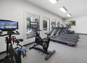 Thumbnail 3 of 35 - Apartments in Savannah, GA for Rent – The Palms at Chatham- gym with cardio equipment