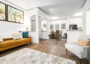 Thumbnail 9 of 35 - Apartments in Savannah, GA for Rent – The Palms at Chatham- a living room and dining room with white walls and hardwood floors