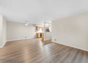 Thumbnail 8 of 47 - A room with wooden floors and a white ceiling.