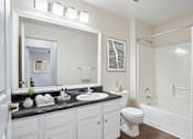Thumbnail 7 of 15 - Apartments for Rent in Little Rock, AR 72223– Capitol Hill -   A bathroom with a white toilet and sink.