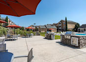 Thumbnail 19 of 31 - Apartments in Oak Ridge, TN for Rent- Centennial Village- pool side grills and picnic tables
