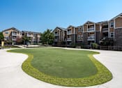 Thumbnail 5 of 31 - Pet-Friendly Apartments in Oak Ridge, TN – Centennial Village – putting green golf area