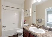 Thumbnail 13 of 31 - Pet-Friendly Apartments in Oak Ridge, TN – Centennial Village – a bathroom with a sink toilet and a shower