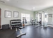 Thumbnail 22 of 31 - Pet-Friendly Apartments in Oak Ridge, TN – Centennial Village – the gym is stocked with weights and cardio equipment