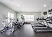 Thumbnail 4 of 31 - Apartments in Oak Ridge, TN for Rent- Centennial Village the gym has plenty of cardio equipment and treadmills