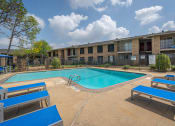 Thumbnail 2 of 28 - our apartments offer a swimming pool and a patio with blue benches