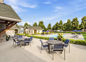 Thumbnail 29 of 47 - A patio with a table and chairs overlooking a pool.