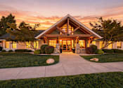 Thumbnail 46 of 47 - A house with a front yard and a driveway.