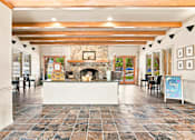Thumbnail 41 of 47 - A room with a fireplace and a sign that says "Sunny Days".