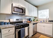 Thumbnail 2 of 21 - Collier Flats Apartments in Atlanta GA photo of stainless steel appliances