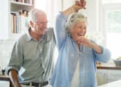 Thumbnail 11 of 18 - Active 55+ couple enjoying senior apartment living at Sage 5430 in Norcross, GA