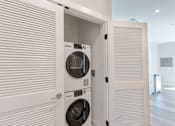 Thumbnail 8 of 22 - Private laundry closet with full-size washer and dryer included in every unit at Creekline at Fairfield apartments, Fairfield CT.