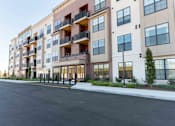 Thumbnail 20 of 22 - Modern Fairfield, CT apartment building with balconies, large windows, and welcoming front entrance at Creekline at Fairfield.