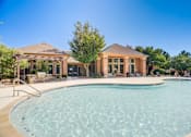 Thumbnail 16 of 20 - A large swimming pool in front of a house.