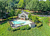 Thumbnail 3 of 17 - A large house with a pool in the backyard.