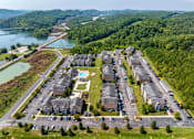 Thumbnail 28 of 31 - Apartments for Rent in Oak Ridge, TN 37830 – Centennial Village – an aerial view of a neighborhood of houses near water