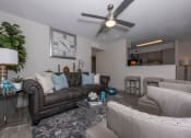 Thumbnail 12 of 31 - Apartments in Lawrenceville Georgia for Rent – Park on Sweetwater - a living room with couches and chairs and a ceiling fan