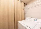 Thumbnail 16 of 31 - Two-BR Apartments In Lawrenceville, GA - Park On Sweetwater Apartments - In-Unit Laundry With A Shelf For Storage