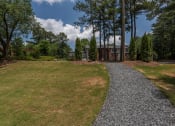 Thumbnail 24 of 31 - Apartments in Lawrenceville Georgia for Rent – Park on Sweetwater - grass area and walking path
