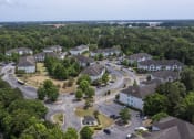 Thumbnail 33 of 35 - Apartments in Savannah, GA for Rent – Canvas at Savannah- arial view of a neighborhood with houses and trees