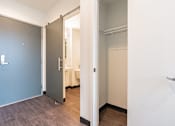 Thumbnail 20 of 54 - A white door is open to a room with a bed.
