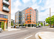 Thumbnail 40 of 40 - A street view of a city with a building named "ERGON".