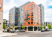 Thumbnail 39 of 40 - A modern multi-story building with the name "FARGO" on the side.