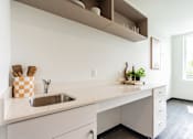 Thumbnail 7 of 54 - A kitchen with a sink and a window.